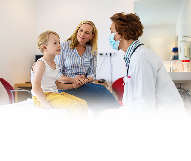 Mother and son sitting in front of doctor