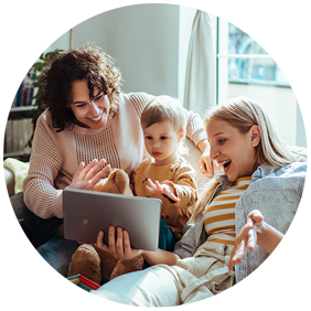 A young couple with a child looking at a tablet device